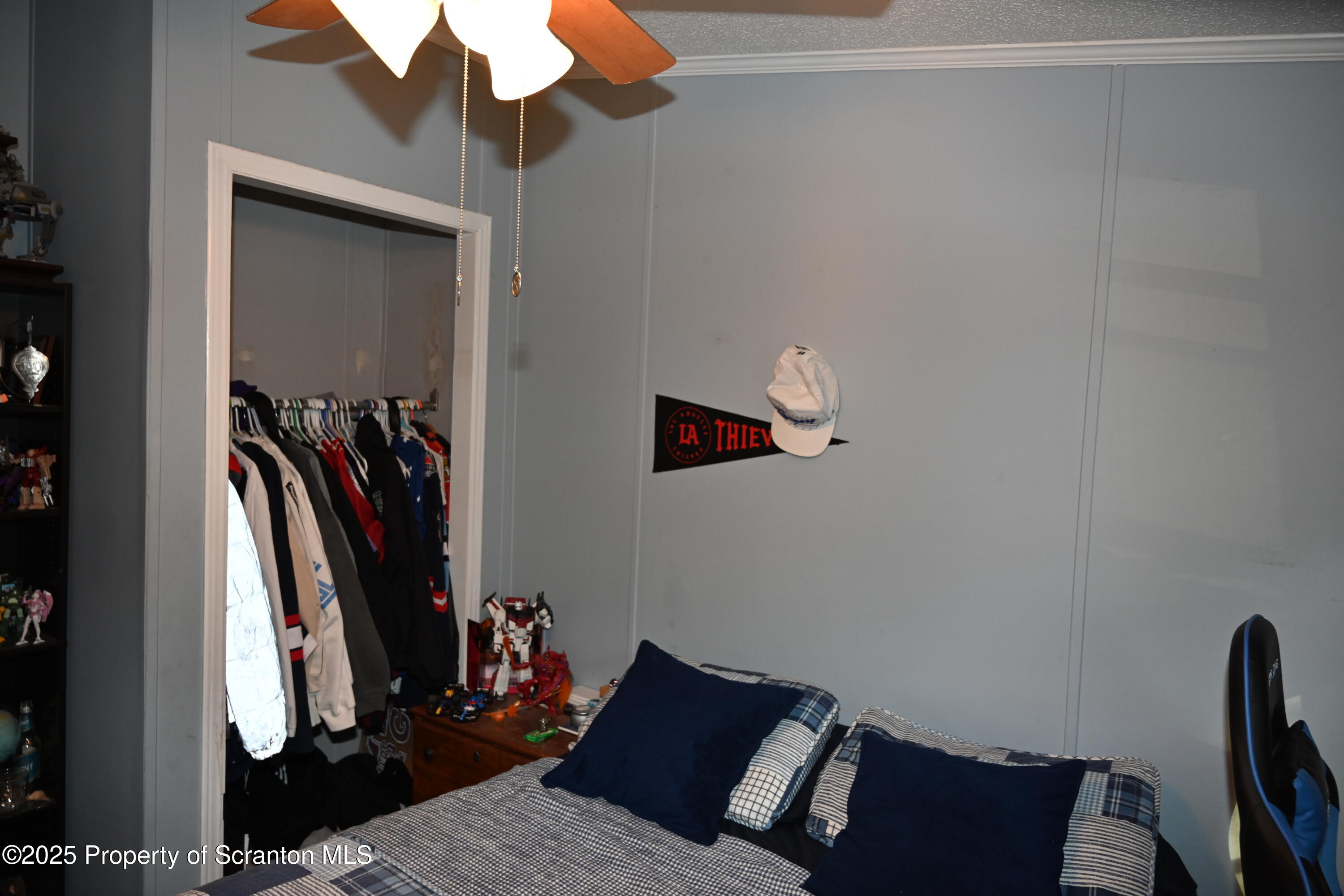 68 Spring Street Great Bend, PA 18821 - Photo 20 of 32 a bed room with a bed and a mirror