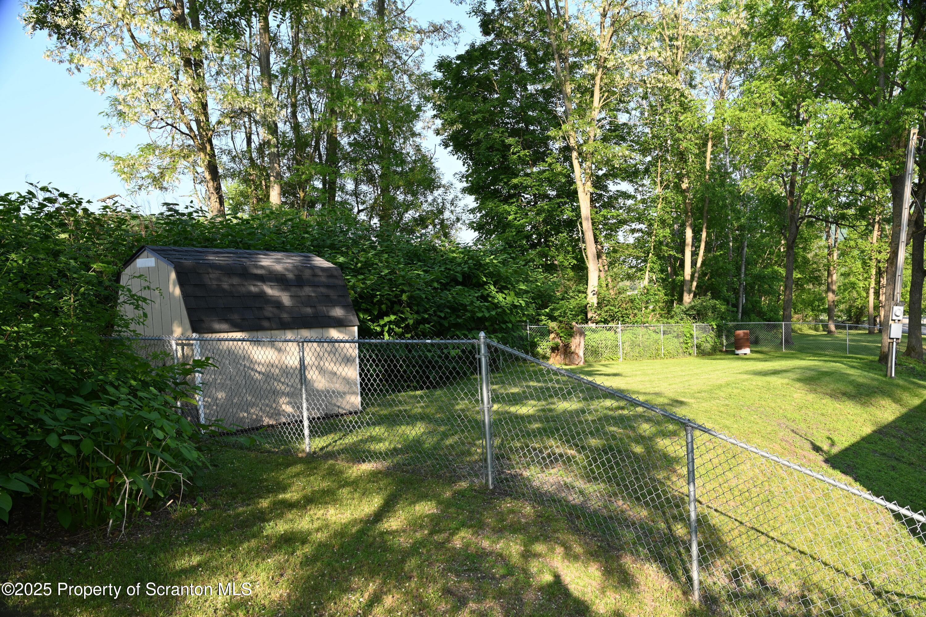 68 Spring Street Great Bend, PA 18821 - Photo 23 of 32 a swimming pool with some trees in the background