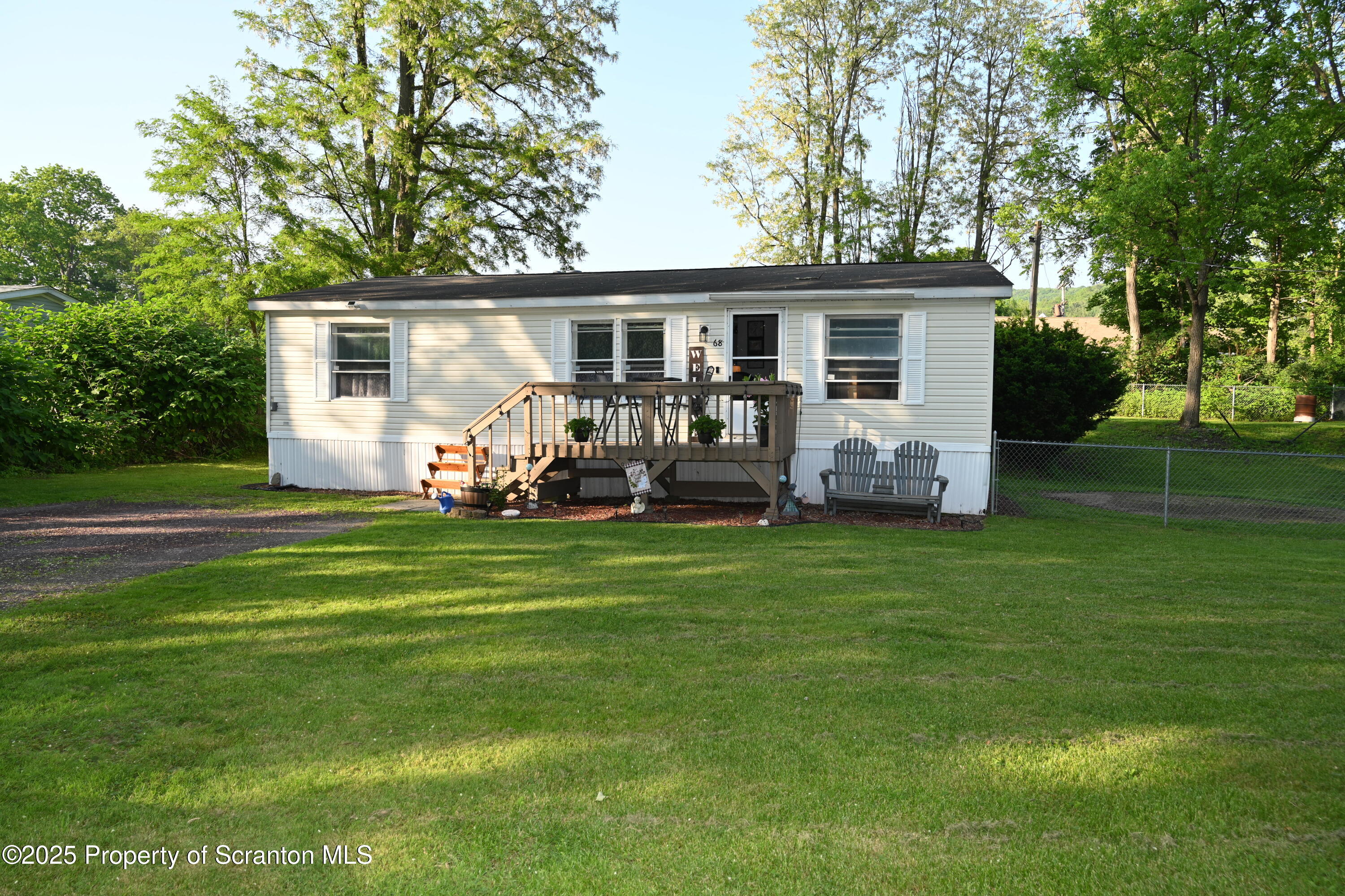 68 Spring Street Great Bend, PA 18821 - Photo 24 of 32 a front view of house with patio and garden