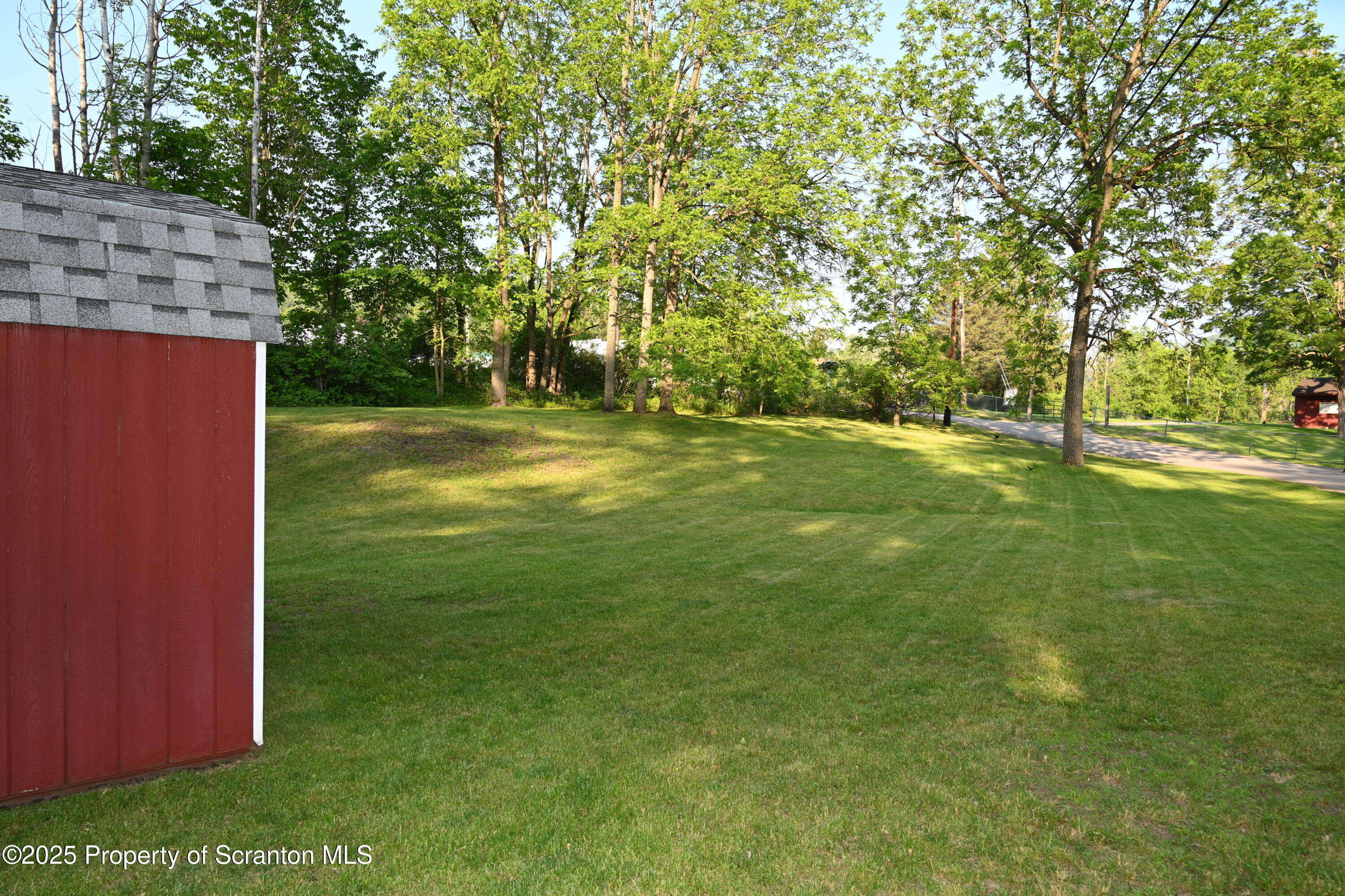 68 Spring Street Great Bend, PA 18821 - Photo 29 of 32 a view of a field of grass and trees