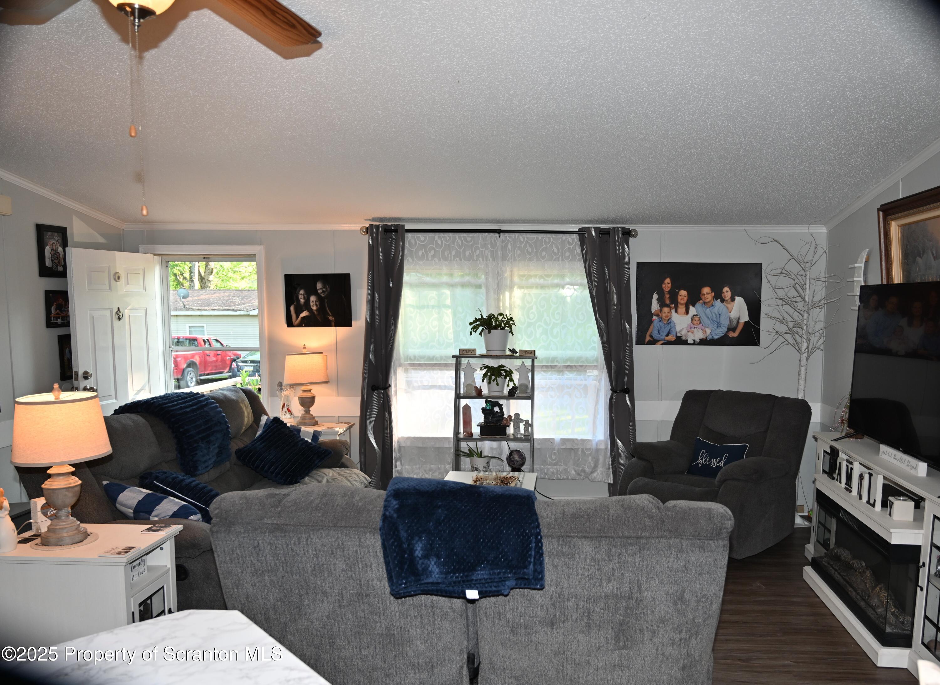 68 Spring Street Great Bend, PA 18821 - Photo 7 of 32 a living room with furniture and a flat screen tv