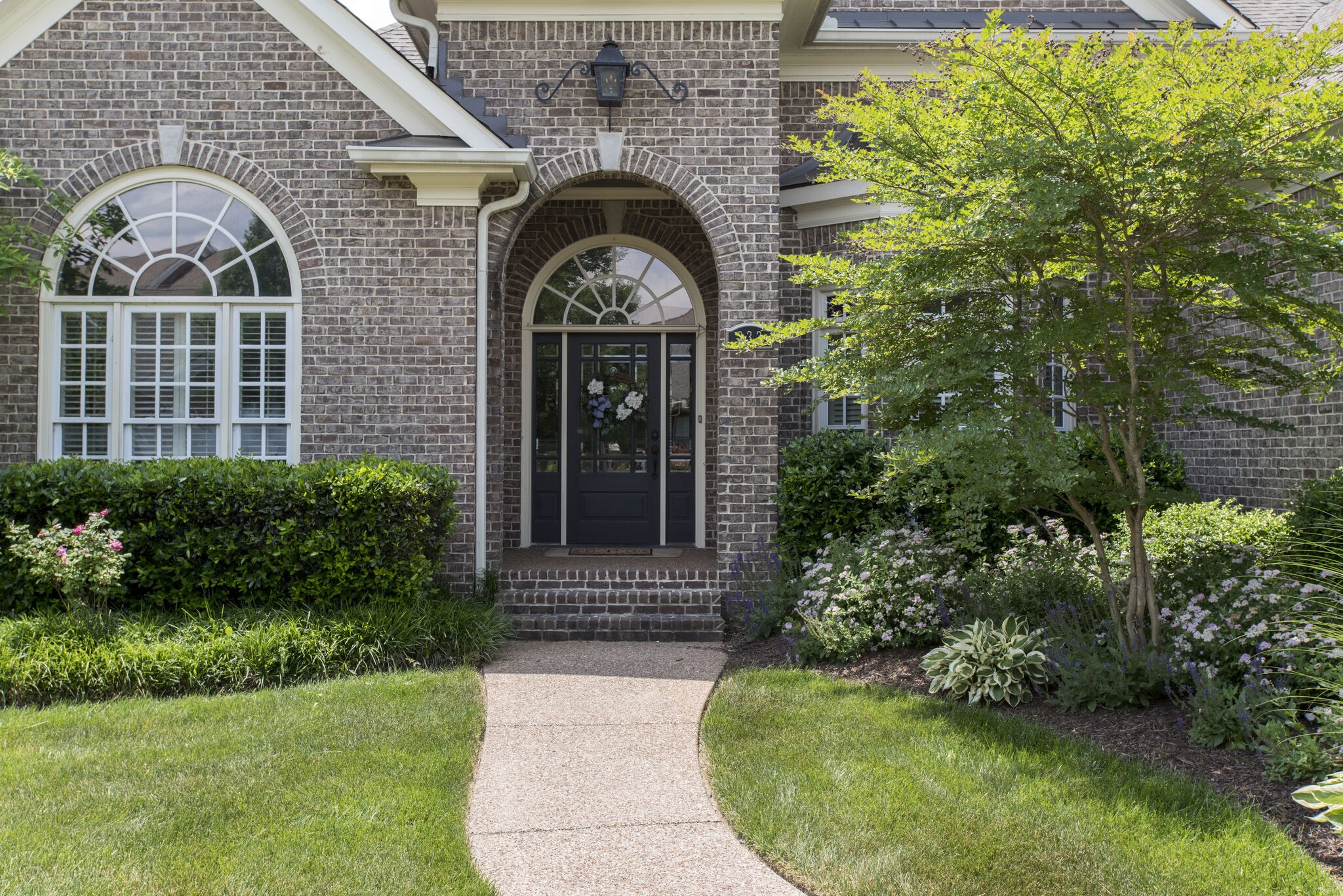 333 Whitewater Way Franklin, TN 37064 - Photo 3 of 39 a front view of a house with garden