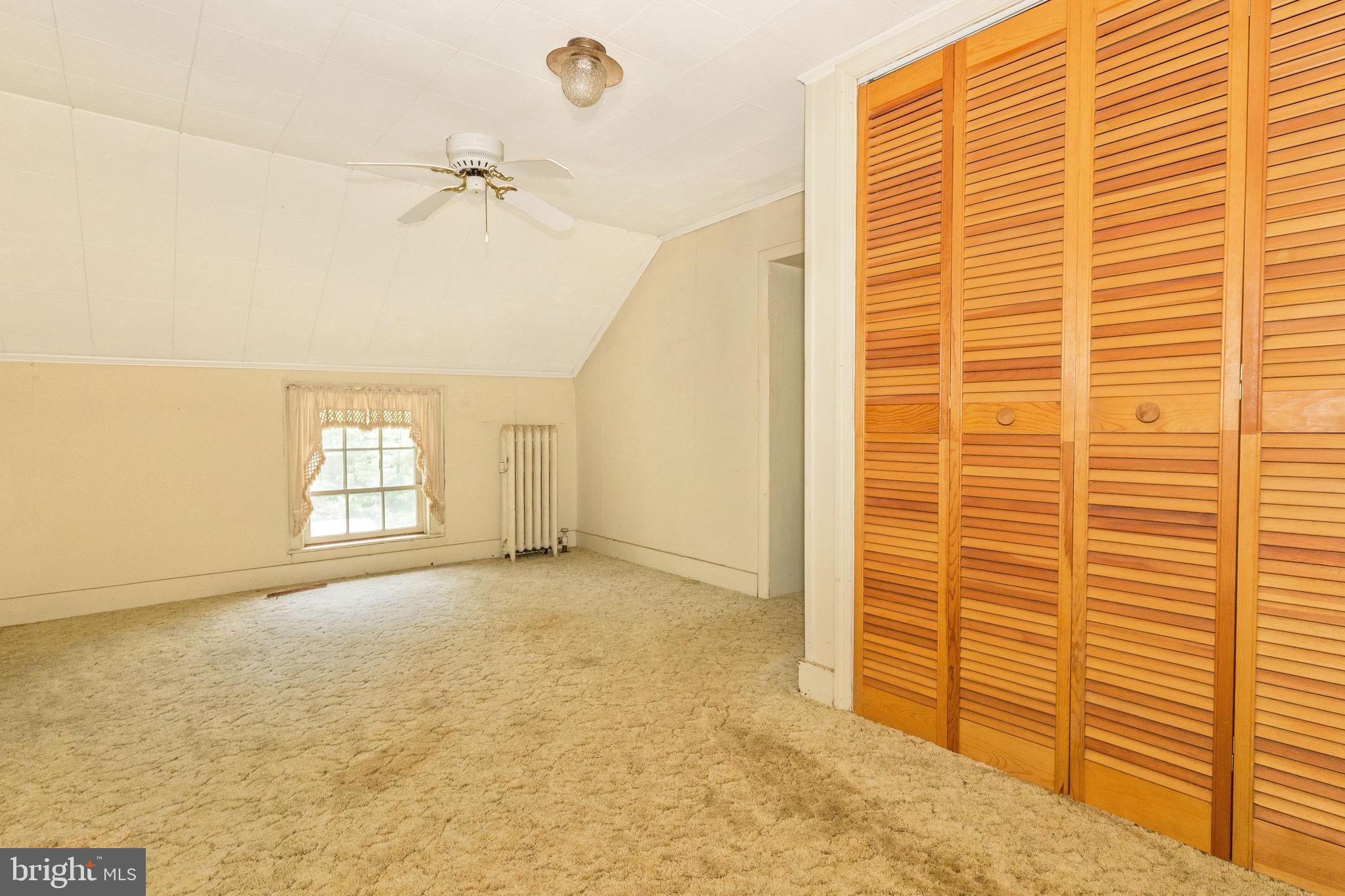 6938 Bowers Road Frederick, MD 21702 - Photo 39 of 40 a view of a room with a window and a ceiling fan