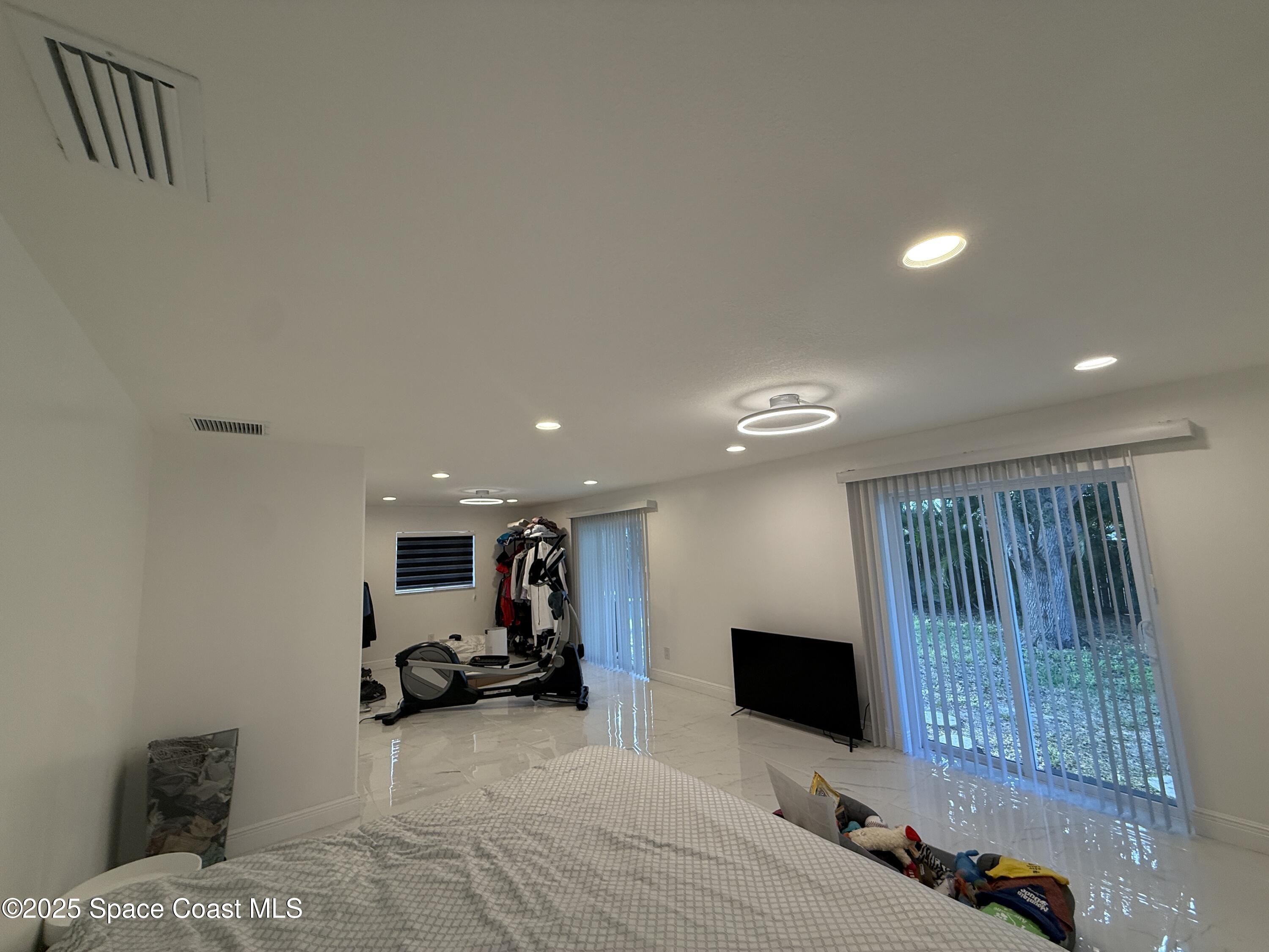 306 School Road Indian Harbour Beach, FL 32937 - Photo 11 of 21 a living room with furniture and a flat screen tv