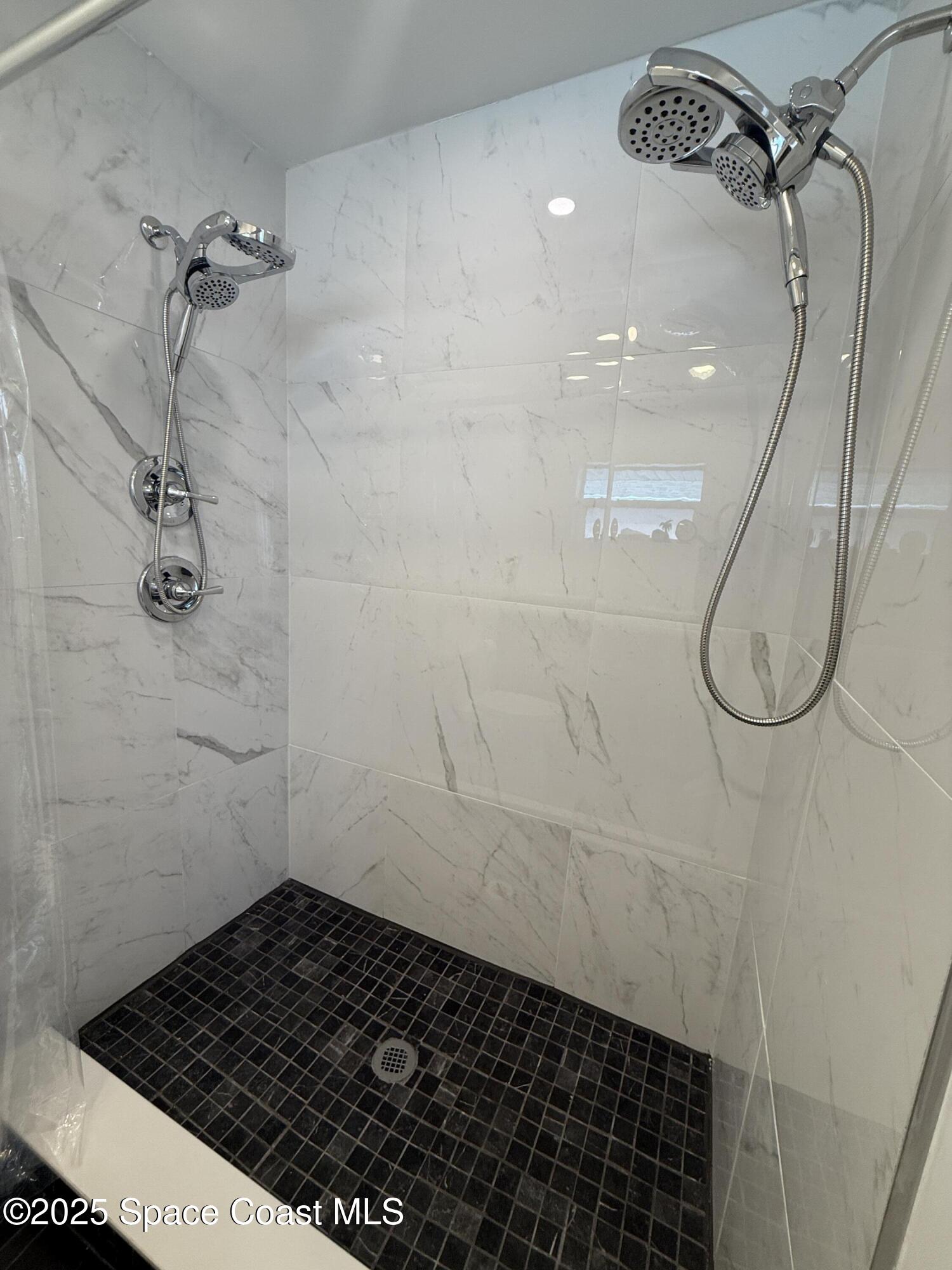 306 School Road Indian Harbour Beach, FL 32937 - Photo 16 of 21 a bathroom with a shower