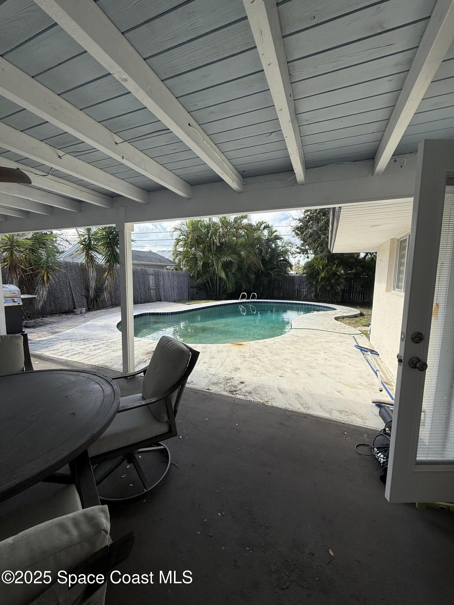 306 School Road Indian Harbour Beach, FL 32937 - Photo 18 of 21 a view of swimming pool with outdoor seating