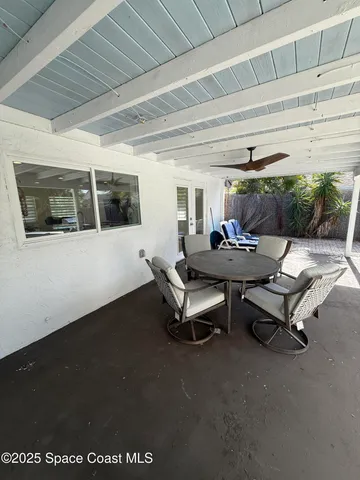 a view of a house with swimming pool and sitting area