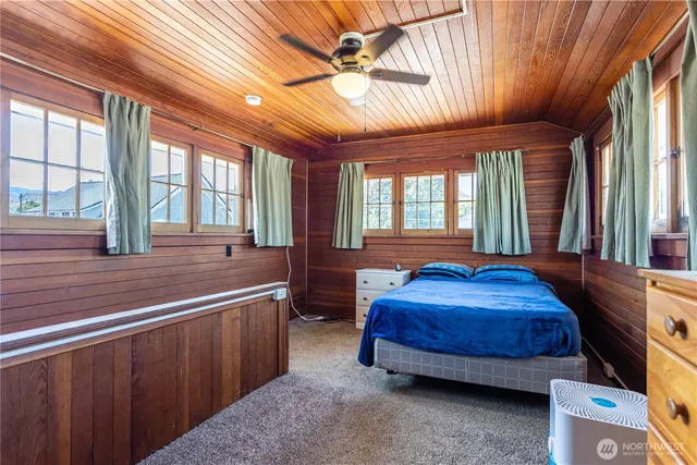 a bedroom with a bed and window