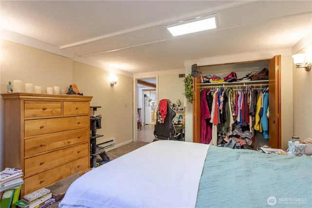 a view of walk in closet with clothes