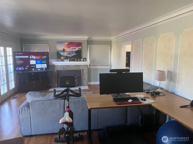 a living room with furniture and a flat screen tv