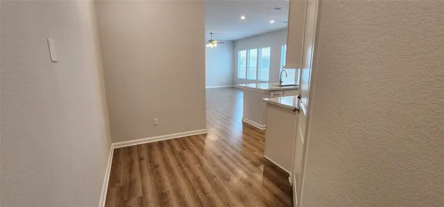 wooden floor in a hall with an entryway