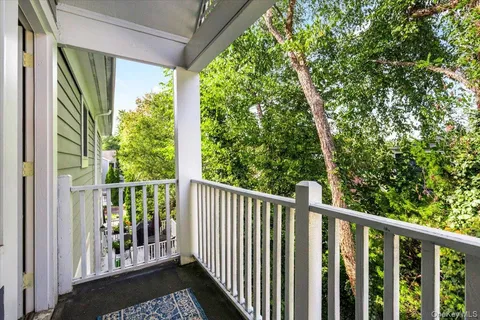 a view of a balcony with wooden floor