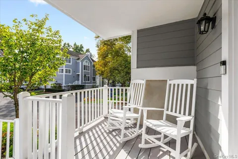 a view of a chair and table in the balcony