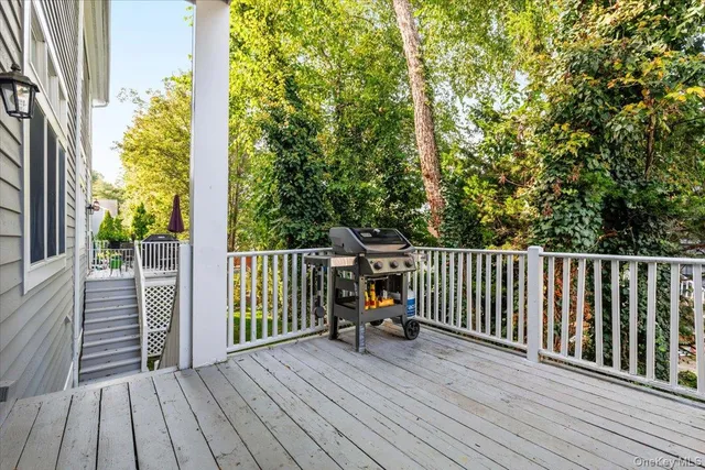 a view of balcony with wooden floor and fence