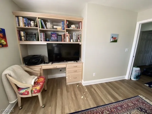 a bedroom with a bed and a bookshelf