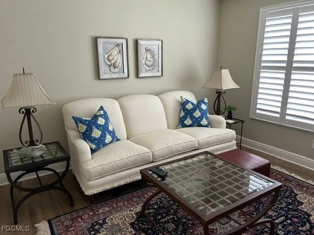 a living room with furniture and a window
