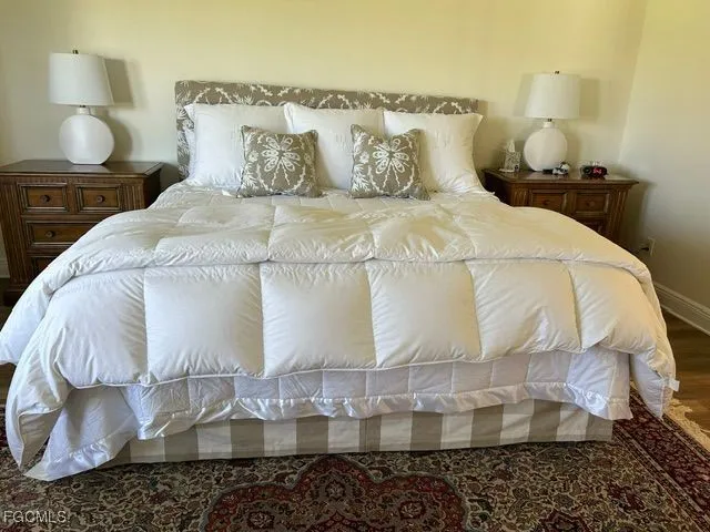 a bathroom with a bathtub and pillows