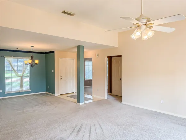 a view of a livingroom with a fireplace and window
