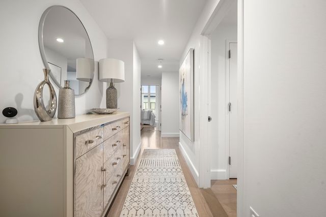 a spacious bathroom with a double vanity sink and a mirror