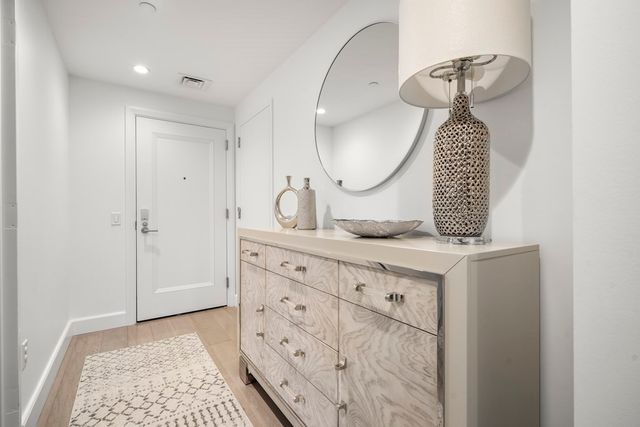 a bathroom with a sink a vanity and a mirror