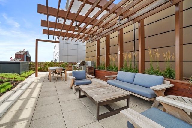 a backyard of a house with yard and outdoor seating