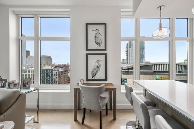 a view of a dining room with furniture window and outside view