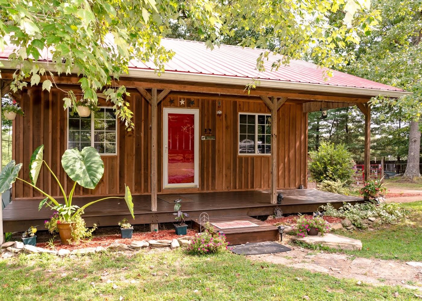 9740 Davis Branch Road Bon Aqua, TN 37025 - Photo 1 of 27 a front view of a house