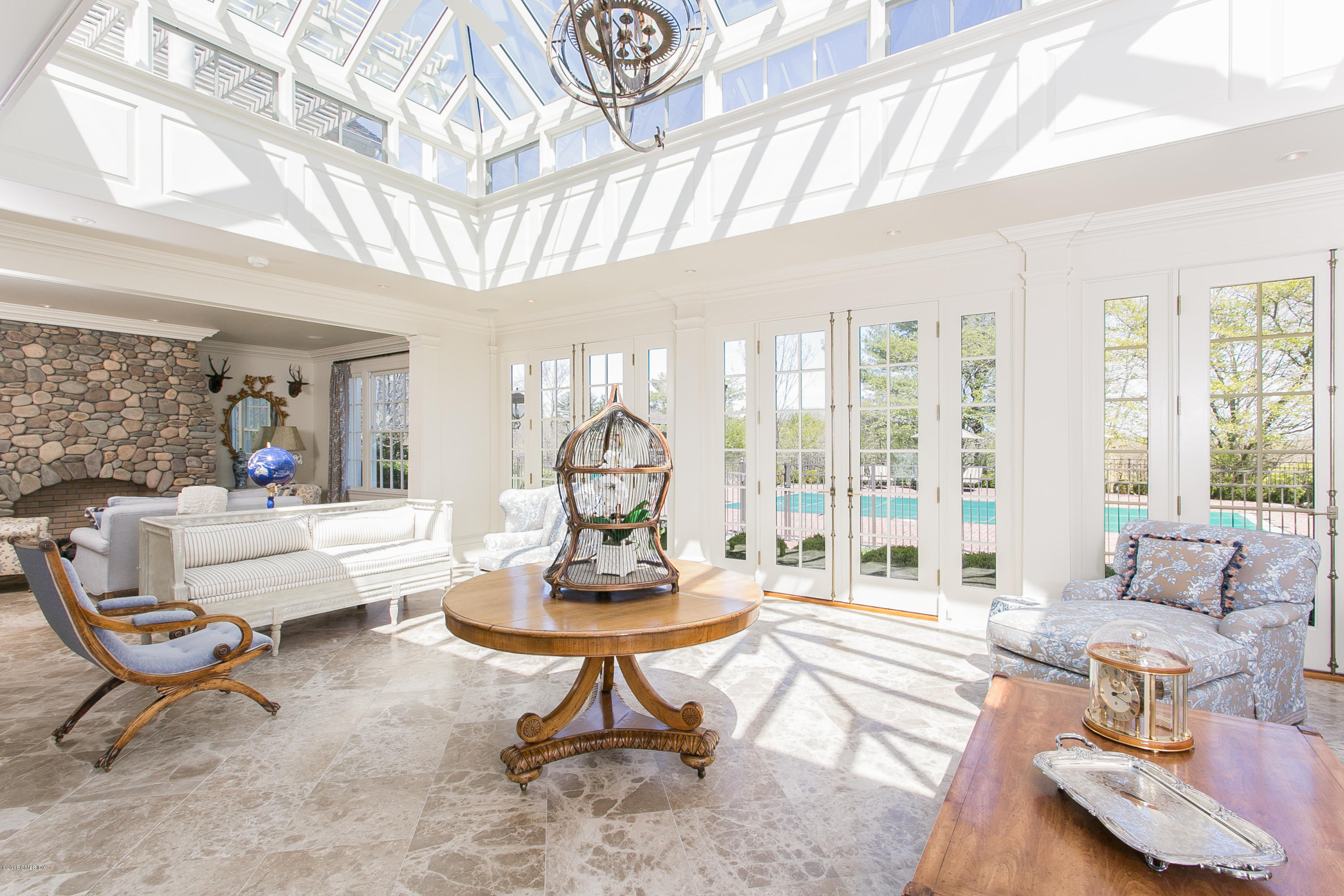 449 Round Hill Road Greenwich, CT 06831 - Photo 12 of 57 a living room with furniture and a large window