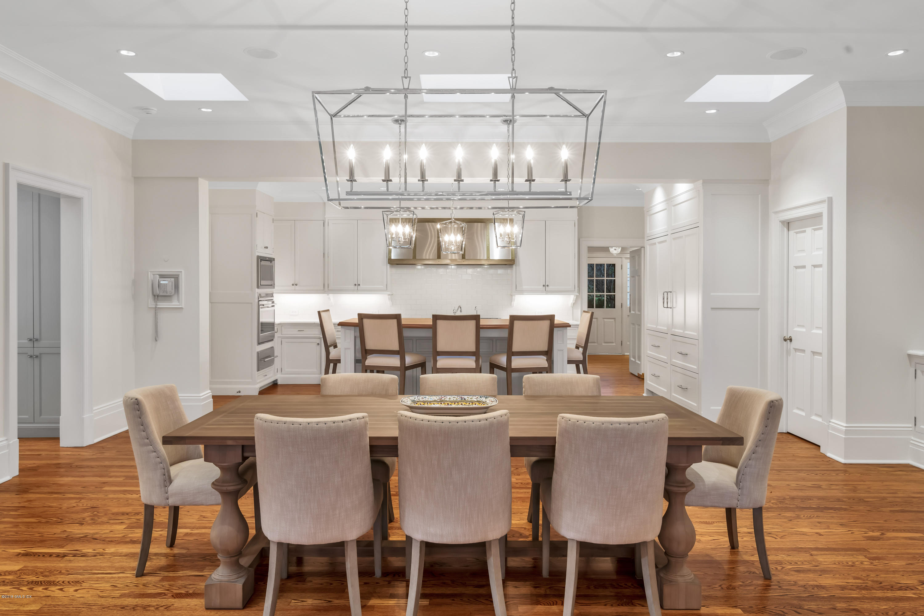 449 Round Hill Road Greenwich, CT 06831 - Photo 18 of 57 a view of a dining room with furniture a chandelier and chandelier