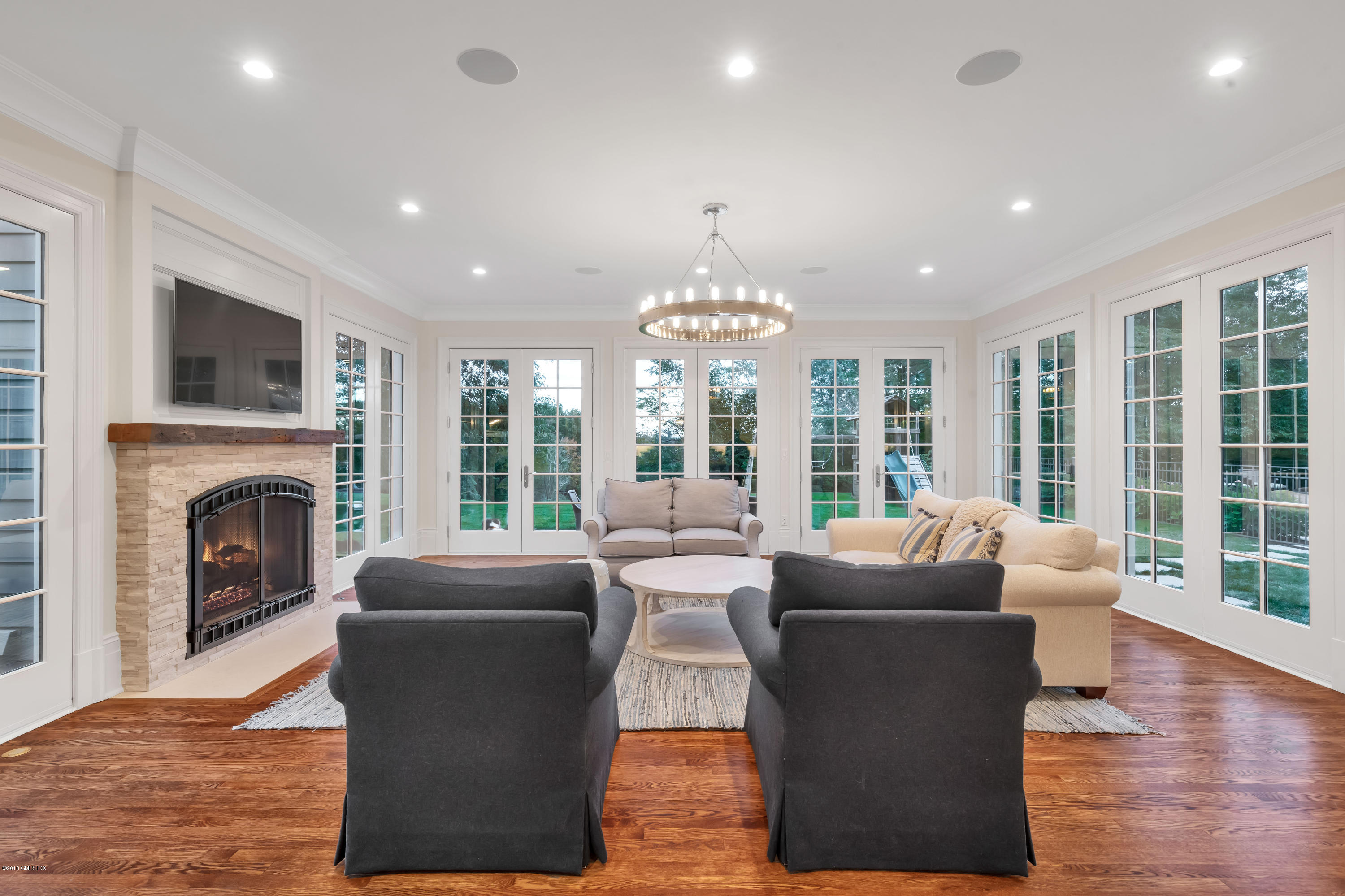 449 Round Hill Road Greenwich, CT 06831 - Photo 23 of 57 a living room with furniture and a fireplace