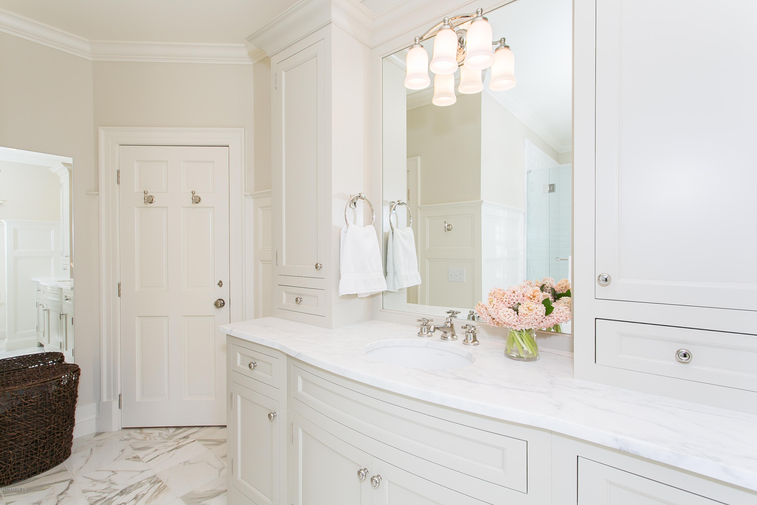 449 Round Hill Road Greenwich, CT 06831 - Photo 31 of 57 a bathroom with a sink a vanity and a mirror