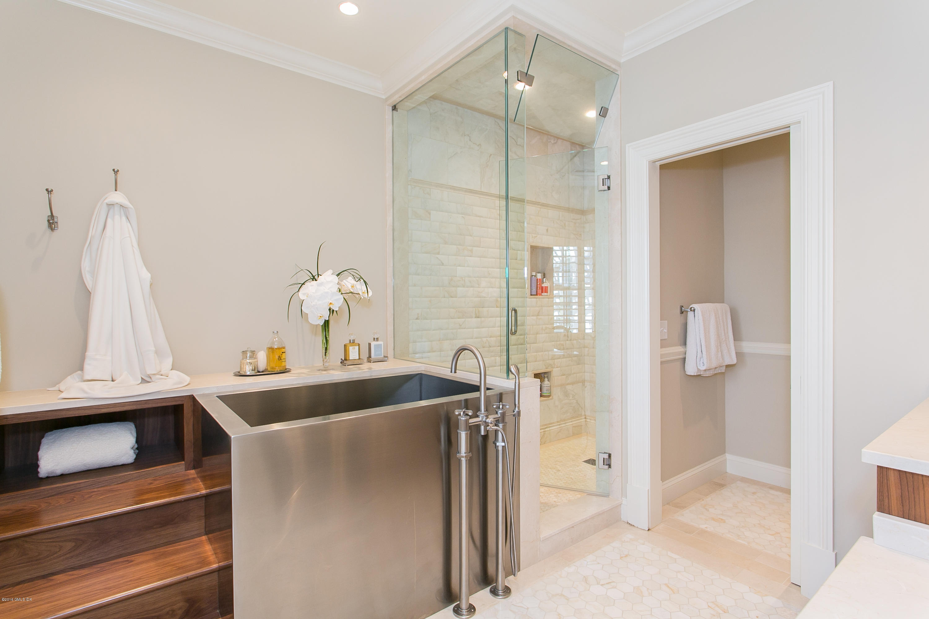 449 Round Hill Road Greenwich, CT 06831 - Photo 34 of 57 a bathroom with a sink and mirror