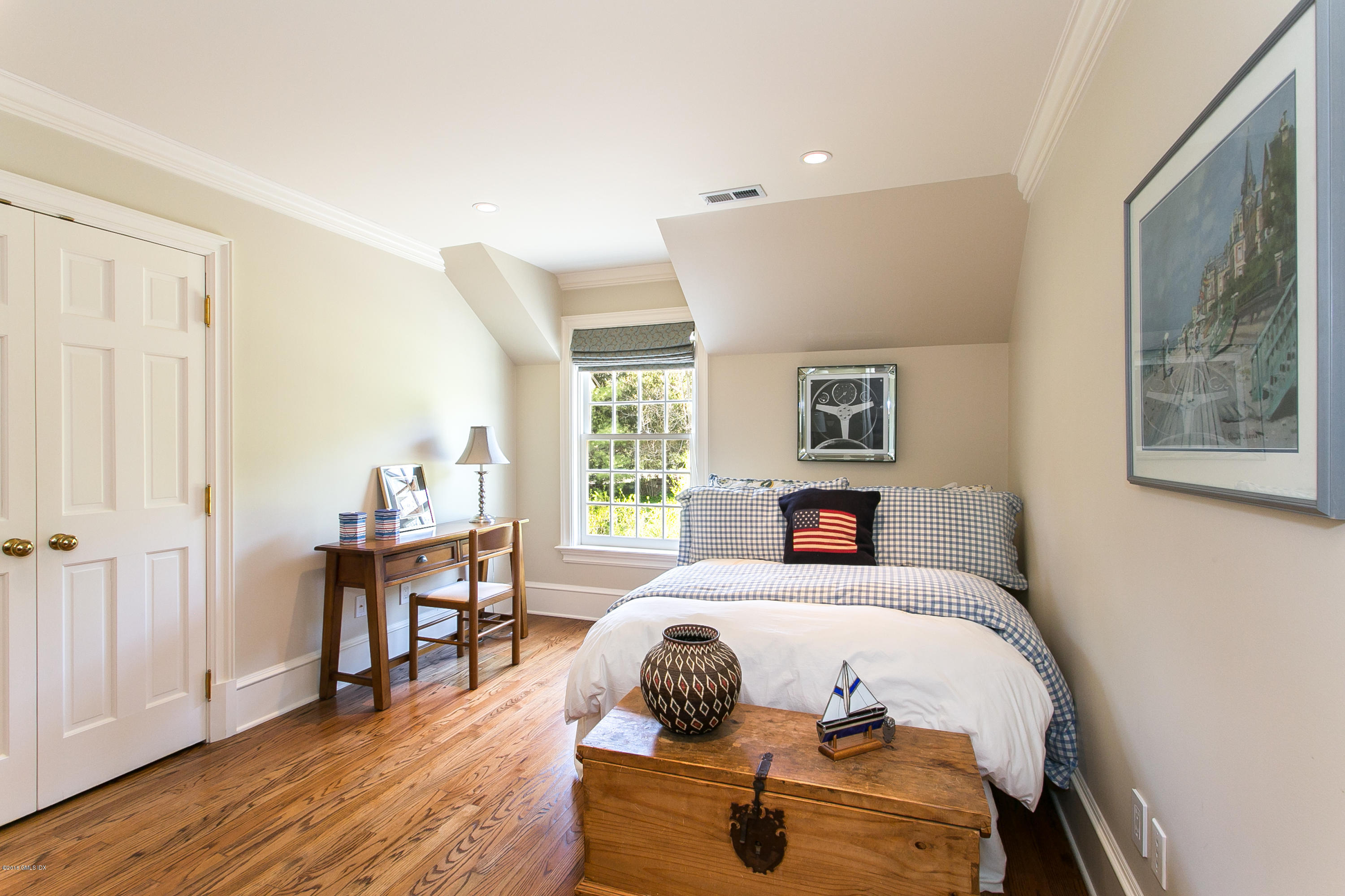 449 Round Hill Road Greenwich, CT 06831 - Photo 41 of 57 a bed room with a bed and a chair