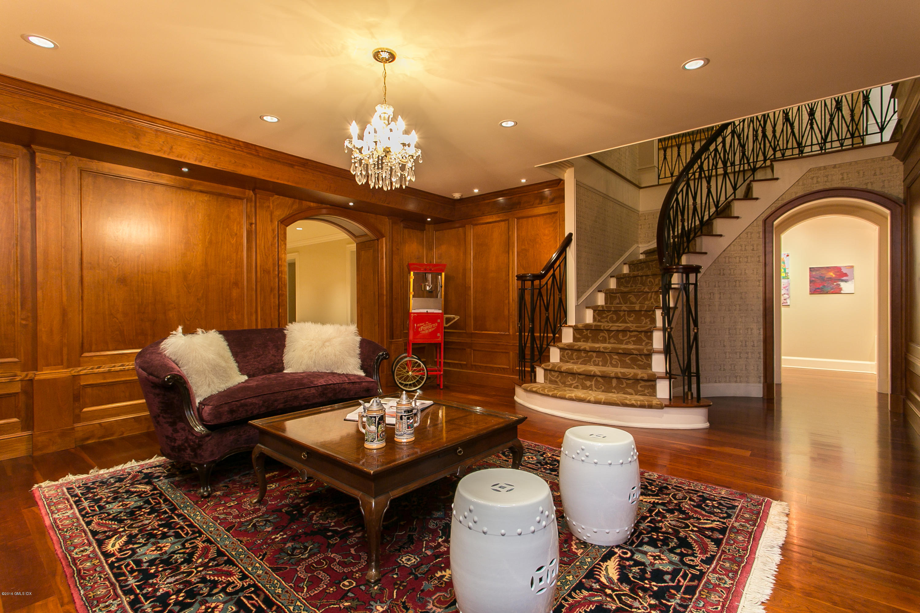 449 Round Hill Road Greenwich, CT 06831 - Photo 44 of 57 a living room with furniture and a chandelier