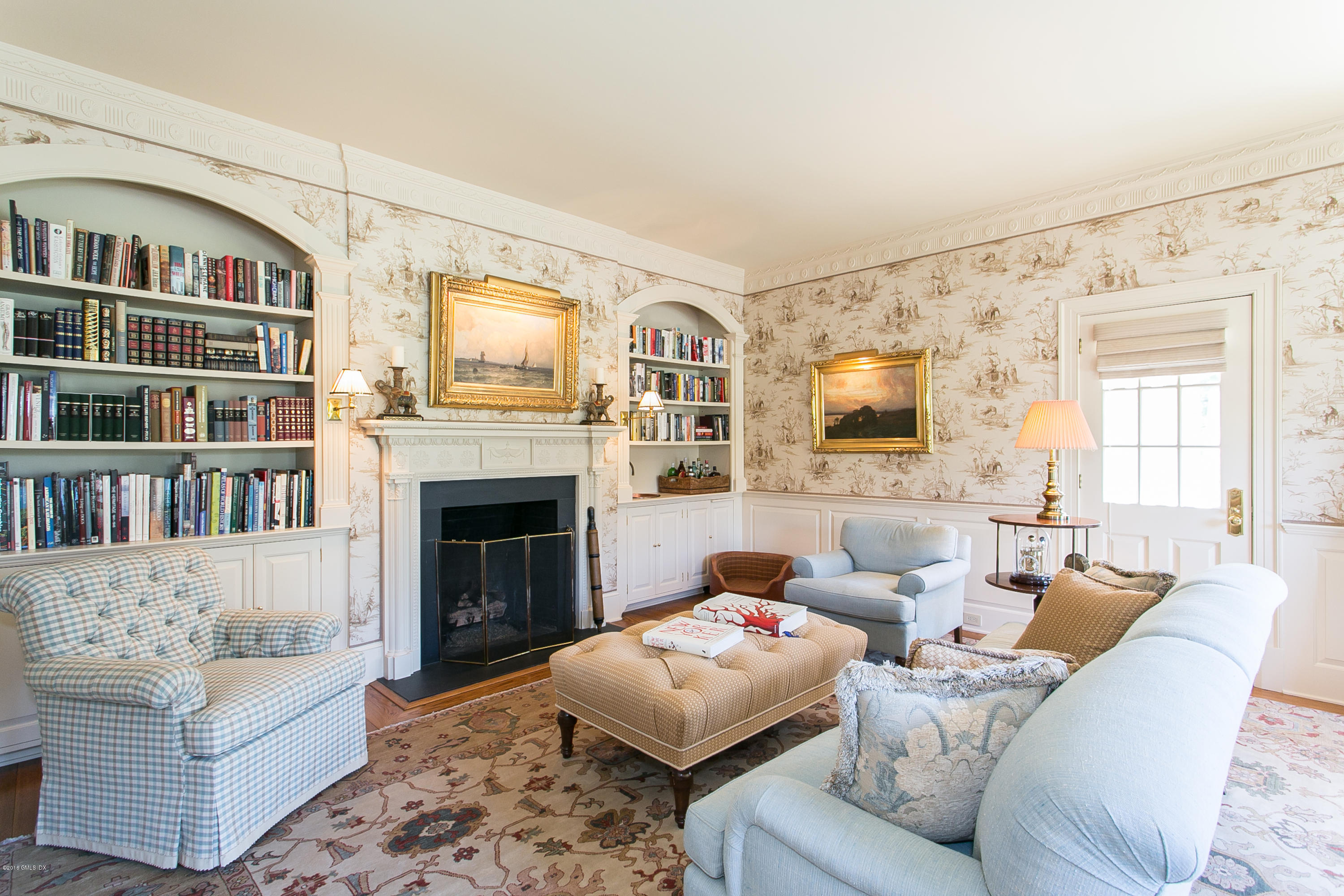 449 Round Hill Road Greenwich, CT 06831 - Photo 8 of 57 a living room with furniture and a fireplace