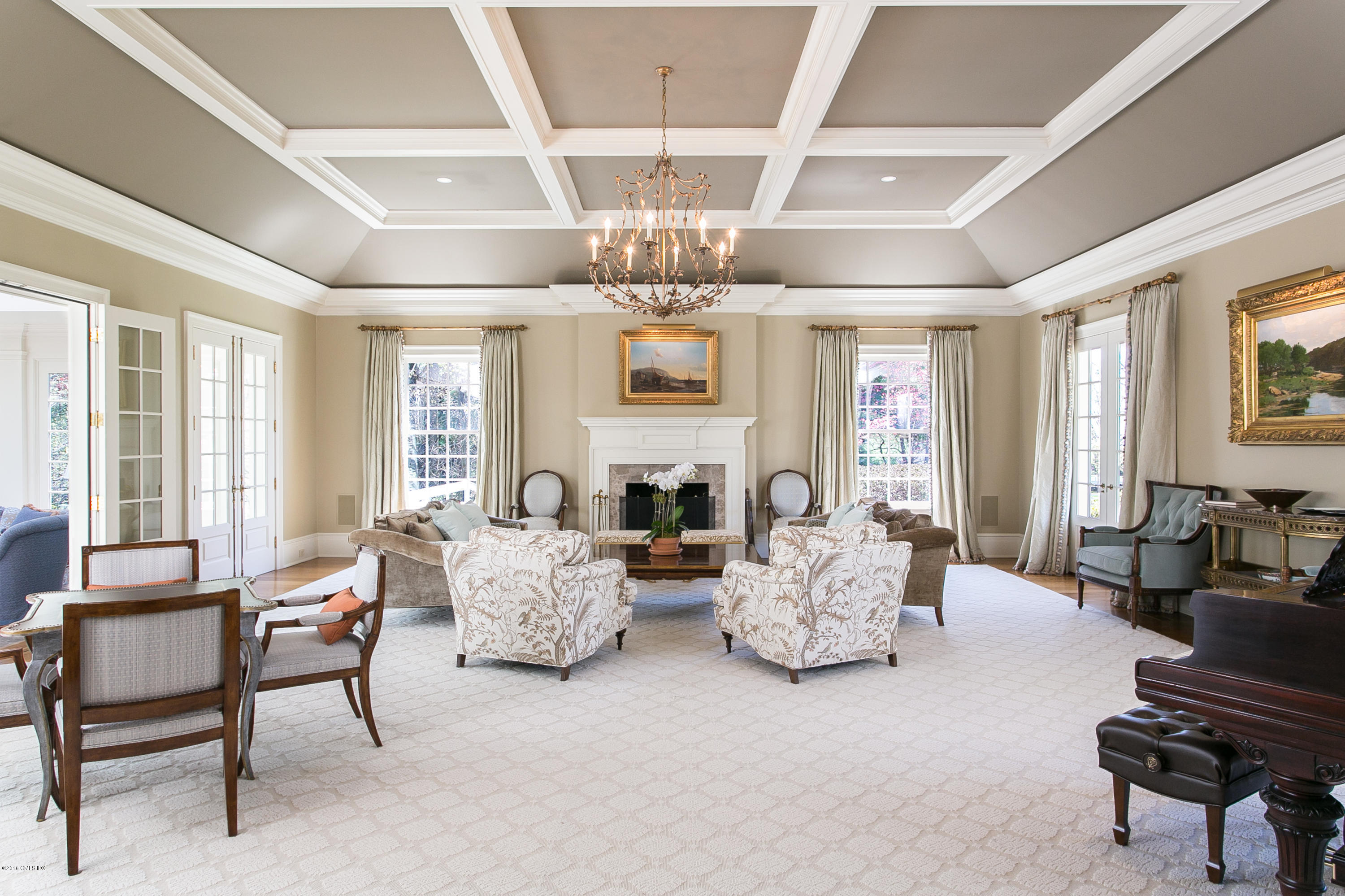449 Round Hill Road Greenwich, CT 06831 - Photo 10 of 57 a living room with fireplace furniture and a chandelier