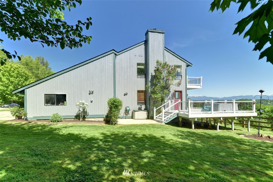 14210 High Bridge Road Snohomish, WA 98296 - Photo 3 of 38 a front view of a house with garden