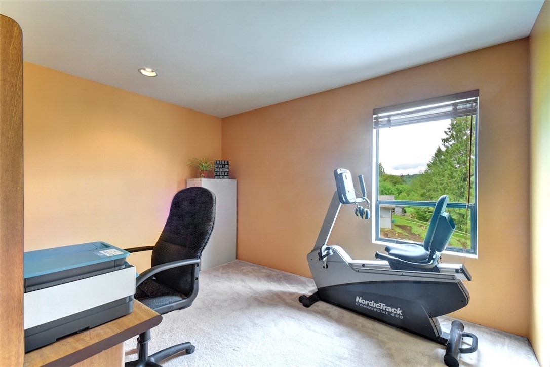 14210 High Bridge Road Snohomish, WA 98296 - Photo 22 of 38 a room with gym equipment and a large window