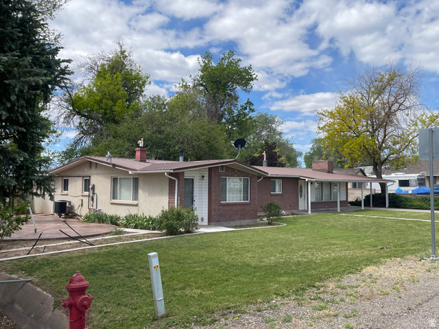 438 East Main Street Elsinore, UT 84724 - Photo 2 of 43 Single-story residence featuring a brick facade and stucco exterior