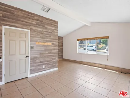 a view of an empty room and workspace