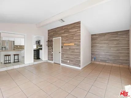 a view of an empty room with a fireplace