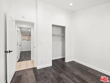 an empty room with wooden floor