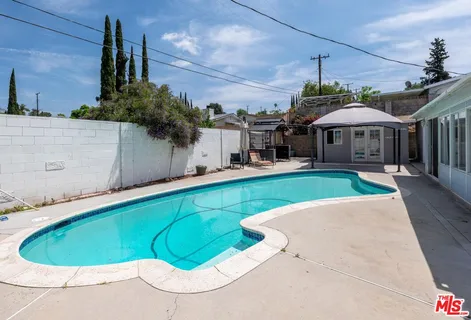 a view of a house with a swimming pool