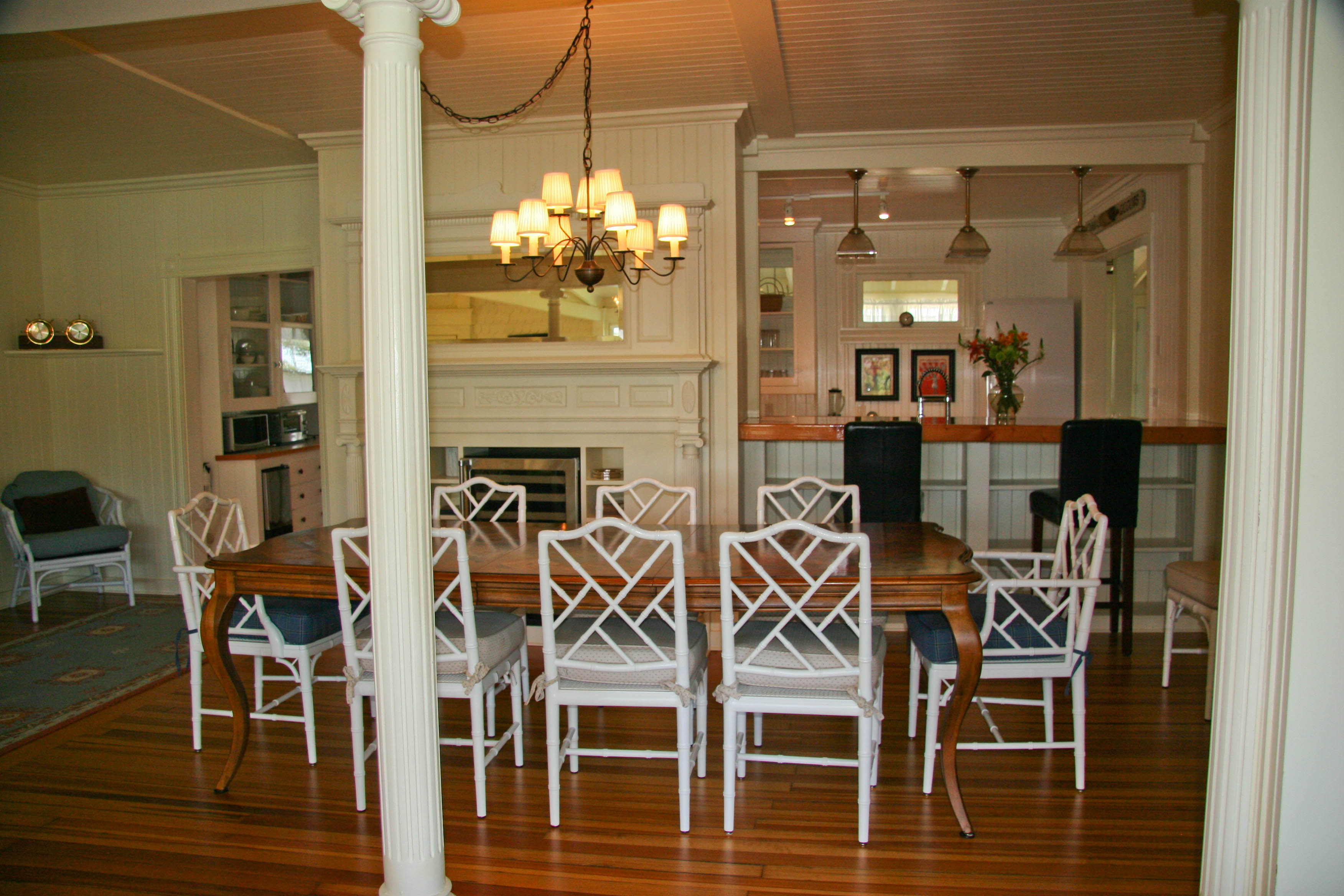 144 Surfside Road Nantucket, MA 02554 - Photo 10 of 46 a view of a dining room with furniture and chandelier