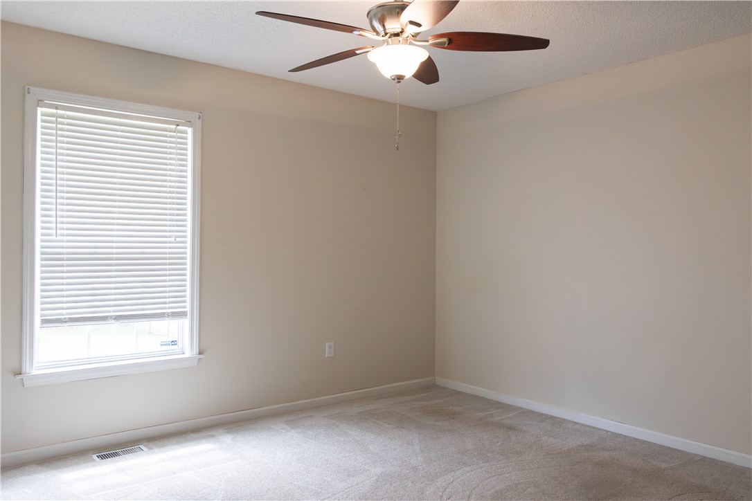 439 Chetola Road Seneca, SC 29672 - Photo 17 of 28 Soft carpeting pairs with neutral walls and a large window in this peaceful bedroom.