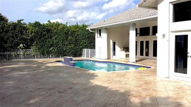 a view of swimming pool with a yard