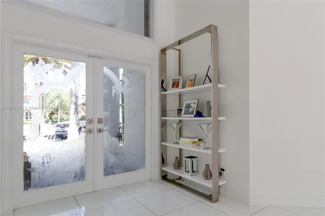 a living room with furniture and large windows