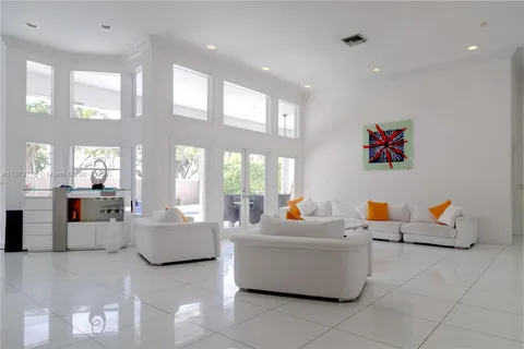 a living room with furniture and white walls