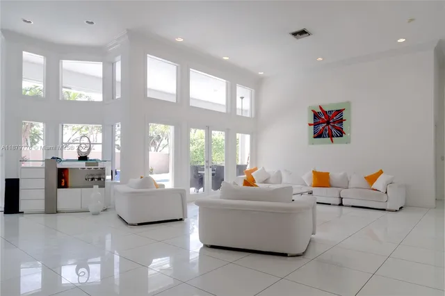 a living room with furniture and white walls