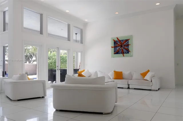 a dining room with furniture and a window
